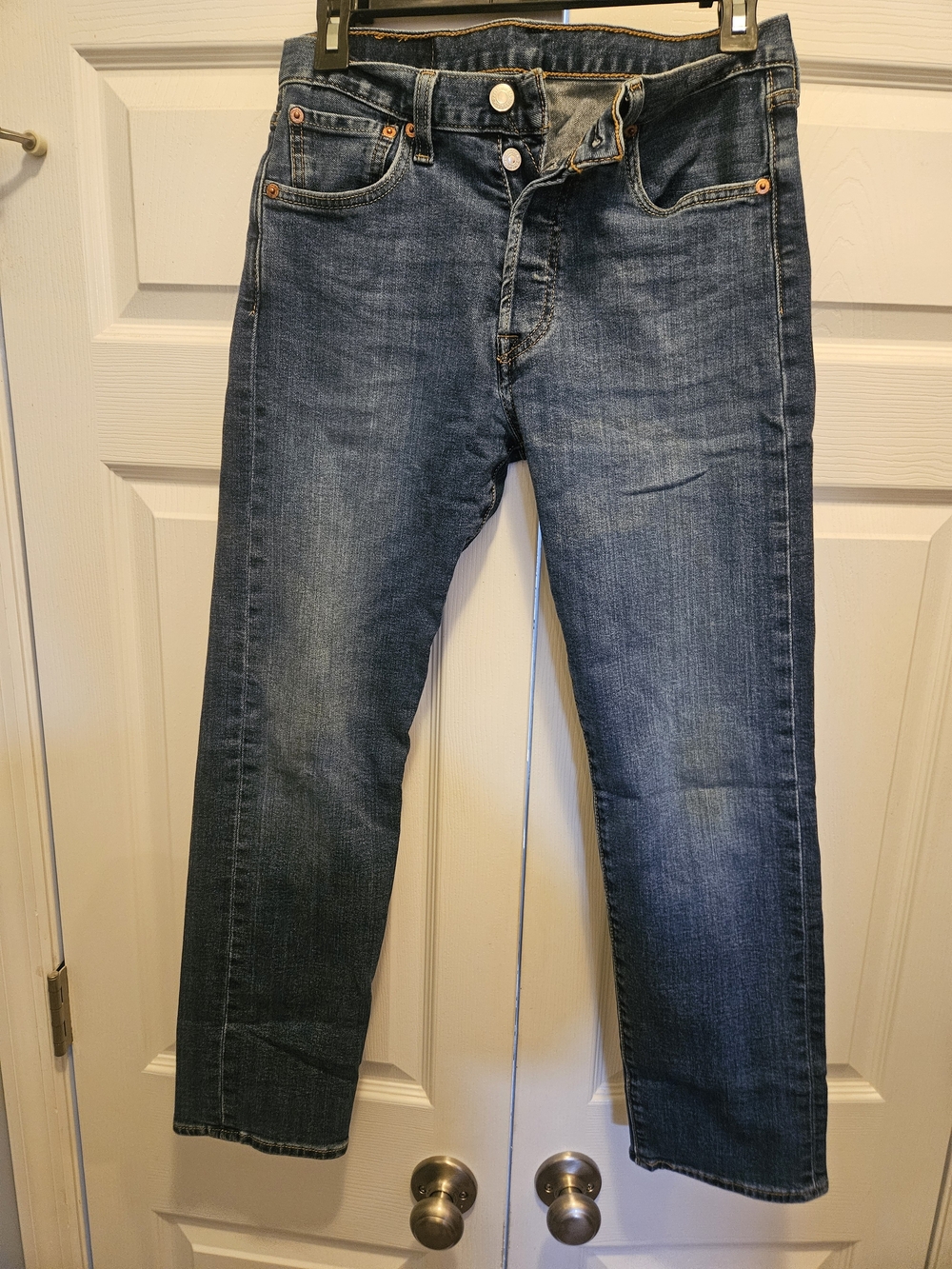 Classic men's Levi's 501 Original Fit jeans in a classic medium blue denim wash.